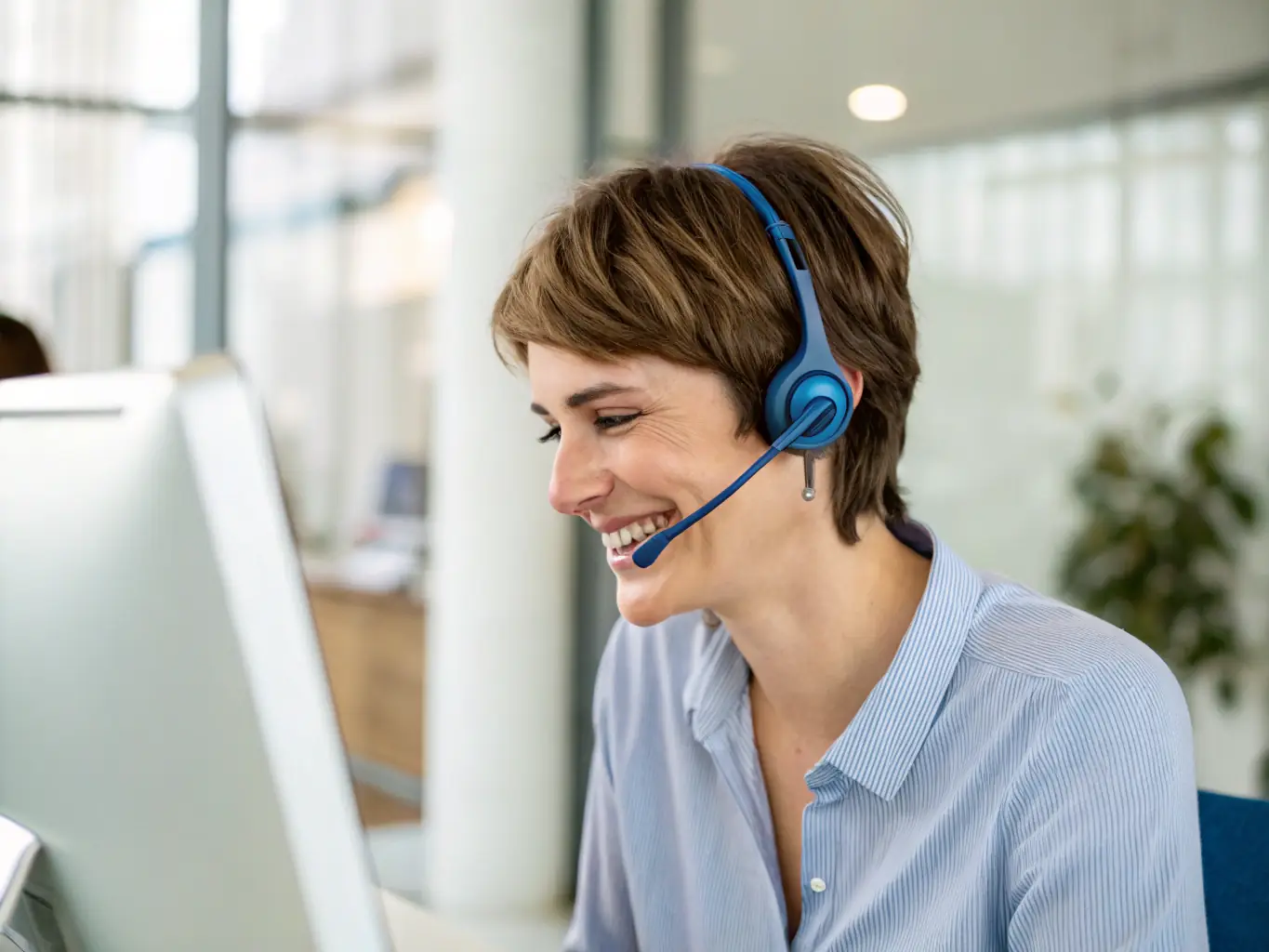 A help desk operator is shown assisting a customer over the phone, with a supportive and professional demeanor, ensuring clear communication and effective problem-solving.